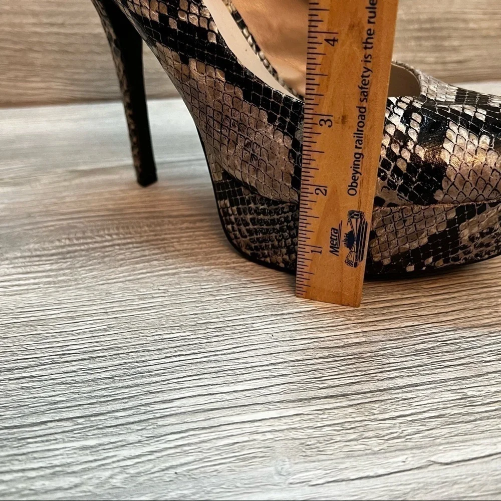 Olsenboye tall platform snakeskin patterned high heels. Closed toe size 9